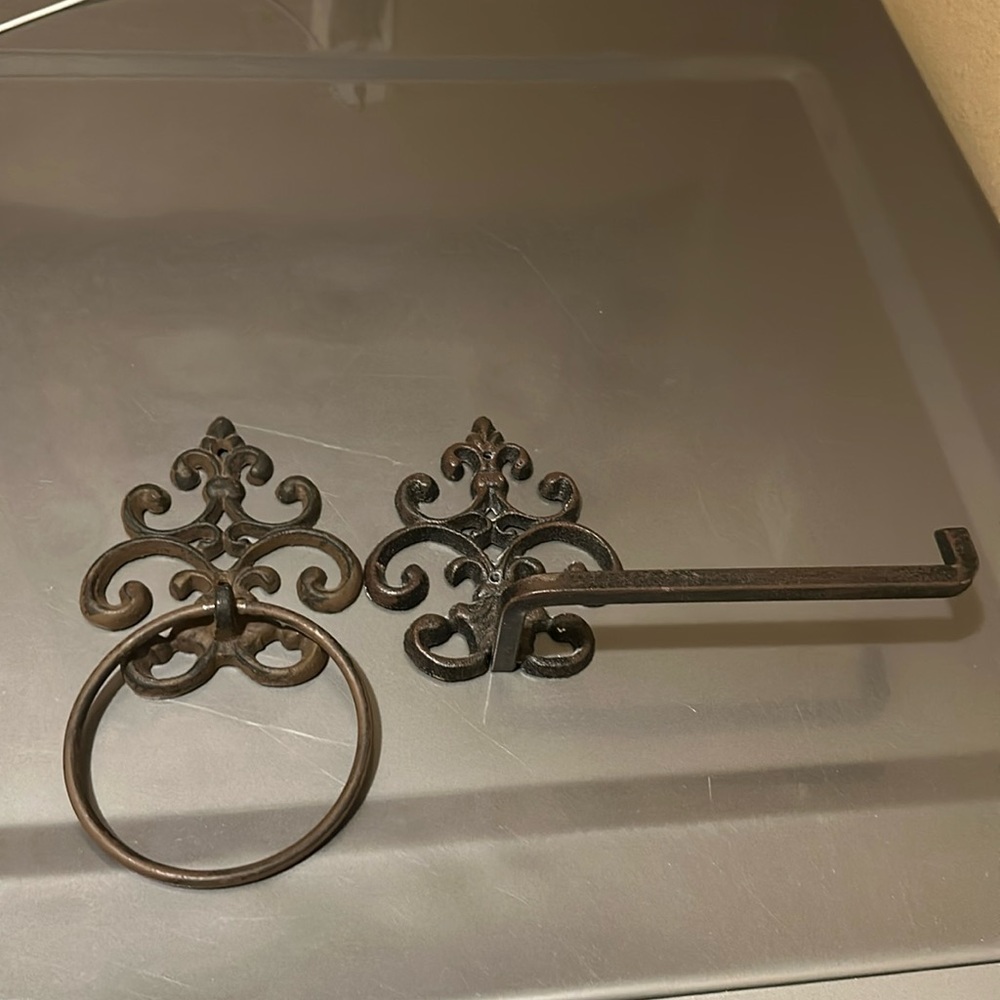 Iron fleur de lis towel ring and toilet paper holder.